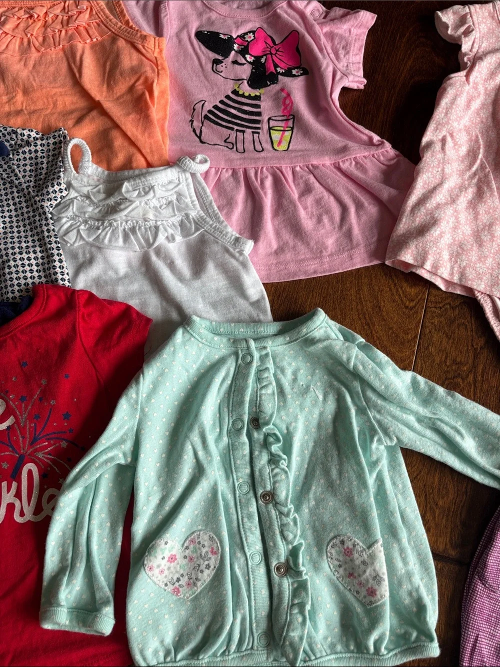 6 tops and 3 rompers with various designs